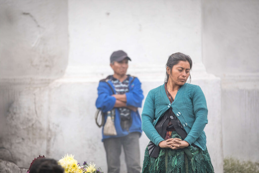 Woman with man in background